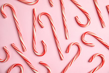 Flat Lay Composition With Tasty Candy Canes On Color Background