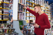 © JackF - Nice man browsing contents on DVD cover