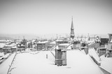 Fototapeta Londyn - Krakow in Christmas time, aerial view on snowy roofs in central part of city. BW photo. Poland. Europe.