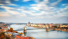 Extra Long 120 Sec. Exposure Artistic Panoramic Landscape Of Budapest Old City In Hungary, View On Danube River Delta, Chain Bridge, Parliament Building And Old Quay Quarters. Autumn Seasonal Scene.