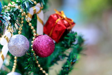 Christmas tree with decorations on a special background blur.