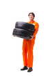 © Elnur - Young garage worker with tyre isolated on white
