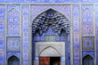 Exterior of Nasir al-Mulk Mosque facade. Persian text at the right door means visiting-hours  of the mosque as English text at the left door. Shiraz, Iran.