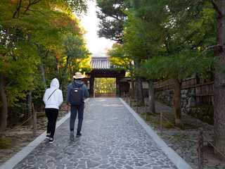 View of the entrance,Ginkakuji Temple with two people walking in, peacefull