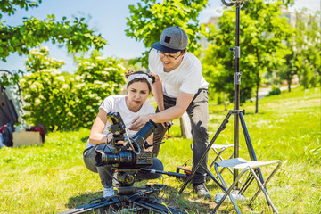 Two young filmmakers on a commercial production exterior set