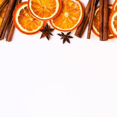 Wall Mural - Christmas Nature background of Dry Oranges Slices and cinnamon sticks