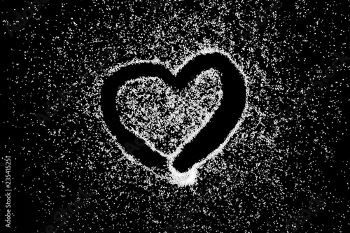 Love Heart Symbol Drawing By Finger On White Salt Powder On Black