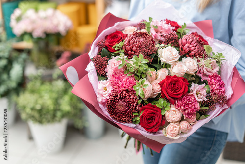 European floral shop. Bouquet of beautiful Mixed flowers in woman hand. Excellent garden flowers in the arrangement , the work of a professional florist. © malkovkosta