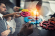 © alphaspirit - Business team connect pieces of gears. Teamwork, partnership and integration concept. double exposure