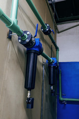 Wall Mural - Side view of the modern industrial pipeline with water filters for heating system