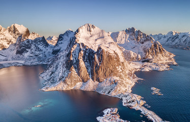 Canvas Print - Aerial view at the Lofoten islands, Norway. Mountains and sea during sunset. Natural landscape from air at the drone. Norway at the winter time