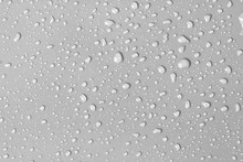 Abstract Water Drop On Surface Of  Fresh Grey Background