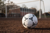 Fototapeta Sport - soccer ball on field