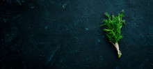 Fresh Green Dill. On A Black Stone Background. Top View. Free Copy Space.