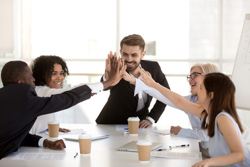 Poster - Happy motivated diverse business team people giving high five together celebrating goal achievement, team spirit, coaching engaging in corporate success, unity, good relations work result, reward