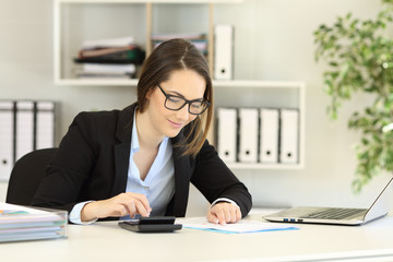 Wall Mural - Office worker doing accounting on a desk