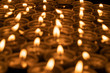 Abstract background of blurred candles in the dark