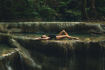 Poster - Sexy woman in the jungle with beautiful waterfall