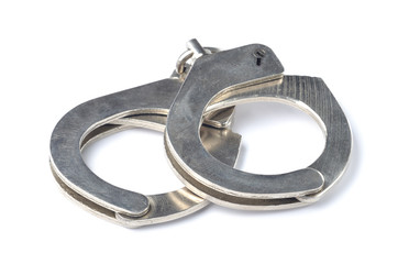 Metal police handcuffs isolated on white background