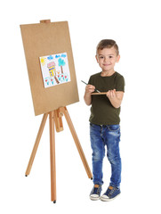 Poster - Child painting picture on easel against white background