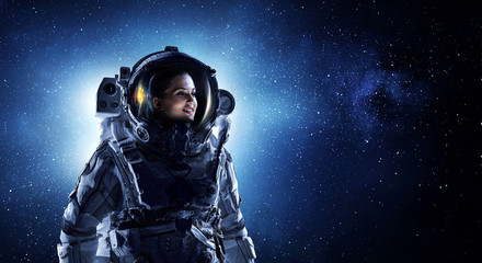 Attractive woman in spacesuit