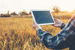 © joyfotoliakid - Smart farming Agricultural technology and organic agriculture Woman using the research tablet and studying the development of rice varieties in rice field
