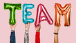 © Rawpixel.com - Hands showing team balloons word
