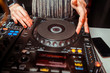 © Семен Саливанчук - DJ mixer on the table background the night club and dancing people