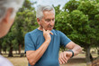 © Rido - Elderly man checking pulse after running