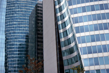 Skyscrapers closeup. Steel, glass and reflections with colours. 