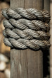 rope tied around wood beam
