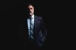 © opolja - Handsome mature business man isolated on black background