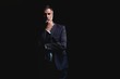© opolja - Handsome mature business man isolated on black background