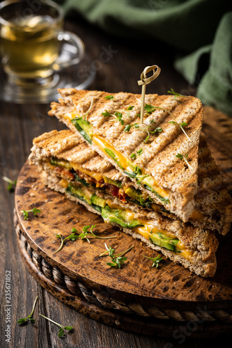 Healthy Toasts With Avocado Cheddar Cheese And Tomatoes For