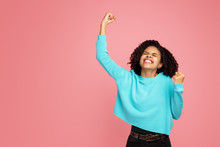 Photo Of Excited Screaming African American Young Woman Standing Over Pink Background.