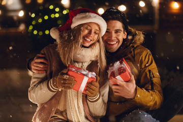 Cheerful young couple dressed in winter clothing