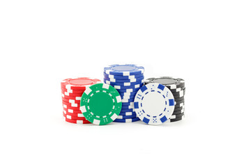 Casino games concept,Stacks of poker chipson gamble table including red, black, white, green and blue on a white background.