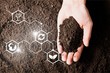 Soil in hand, palm, cultivated dirt, earth, ground, brown land