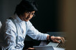 © LUMINA IMAGES - Serious middle-aged Asian businessman working.