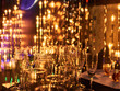 © AllaBond - New years eve festive celebration blurry background with glasses of champagne. Vintage gold Fireworks and bokeh in New Year eve and copy space. holiday background