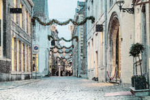 Shopping Street With Christmas Lights And Snowfall In The Dutch City Of Maastricht
