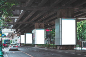 Wall Mural - big blank billboard white led screen vertical outstanding in the city on pathway side the road traff