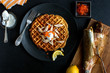 © Andrew Scrivani - Overhead view of potato waffles with smoked trout