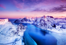 Aerial View At The Lofoten Islands, Norway. Mountains And Sea During Sunset. Natural Landscape From Air At The Drone. Norway At The Winter Time