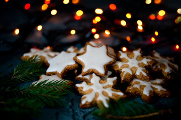 Wall Mural - Christmas cookies snowflakes and stars on a black background