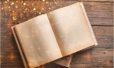 Wall Mural - open book on old wooden table