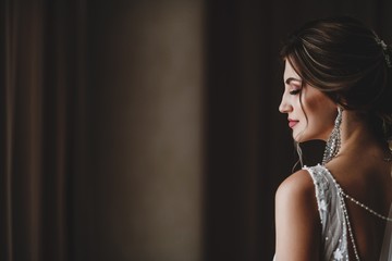 Gorgeous bride in a beautiful dress. Morning newlyweds.