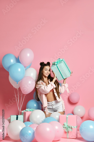 Portrait Of Young Woman In Birthday Party Holding Gift Box With