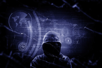 Internet crime concept. Hacker working on a code on dark digital background with digital interface around.