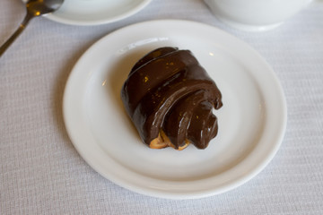 Wall Mural - chocolate bun on white background